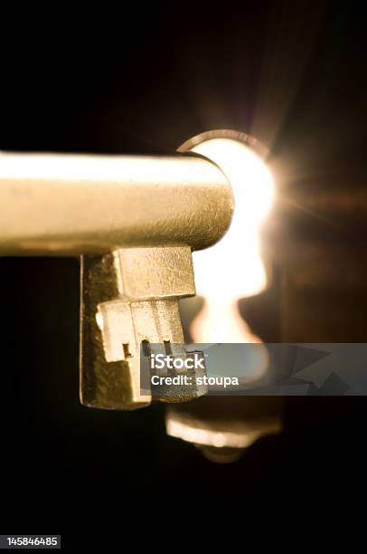 Key In A Keyhole Stock Photo - Download Image Now - Black Color, Building Entrance, Closed