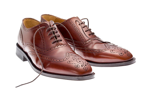 istock Pair of brown brogues on white 145846565
