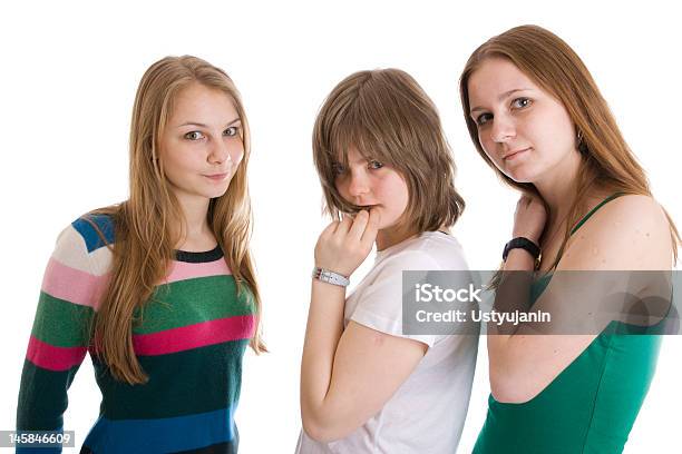 Foto de Três Lindas Meninas Isolada Em Um Branco e mais fotos de stock de Adolescente - Adolescente, Adolescentes Meninas, Adolescência