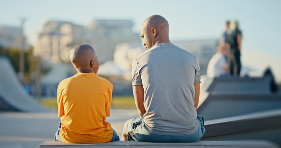 Black family, communication and trust of father and child together talking, discussion or conversation. Man and kid in city for sports, exercise and healthy lifestyle with support and understanding