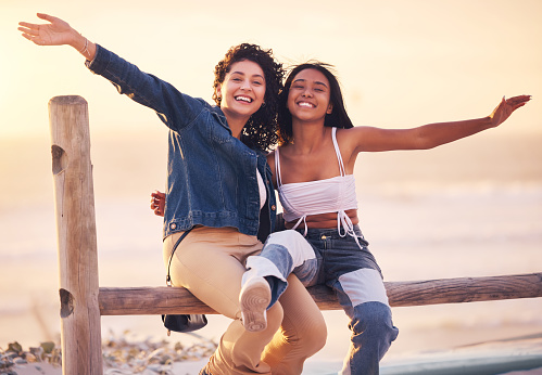 Beach, sunset and portrait of girl friends on outdoor adventure for bonding, peace and sea freedom. Happy, smile and nature women on summer vacation, travel journey or holiday to Miami Florida ocean