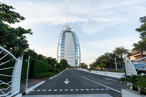 Burj Al Arab Hotel, Dubai against the background of a beautiful cloudy sky during sunset in the evening. Dubai, UAE , United Arab Emirates.