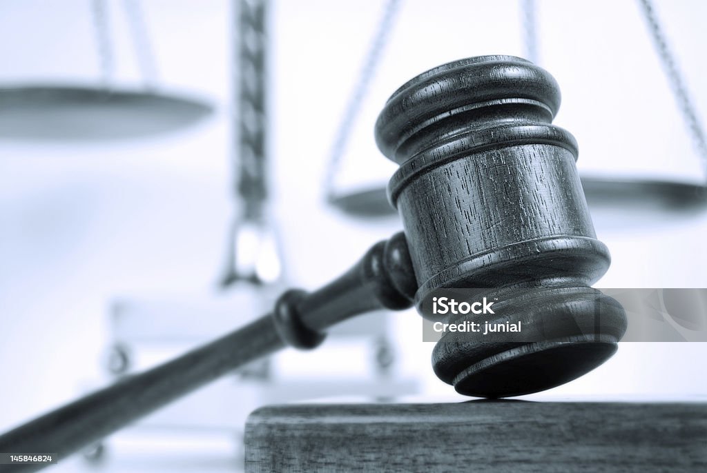 Monotone legal concept Blue tinted monotone image of a gavel and scales of justice Black And White Stock Photo