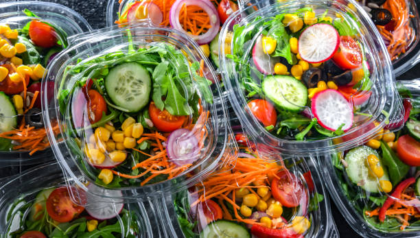 istock Boxes with pre-packaged vegetable salads in a commercial fridge 1458468699