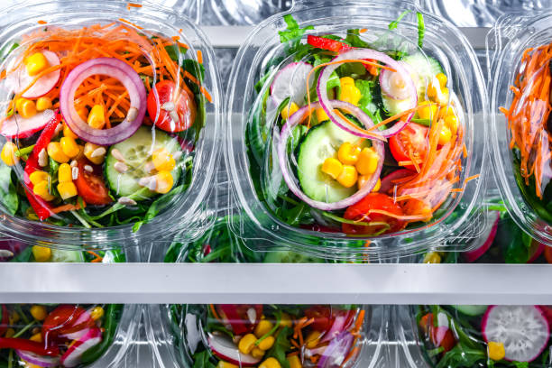 istock Boxes with pre-packaged vegetable salads in a commercial fridge 1458468777