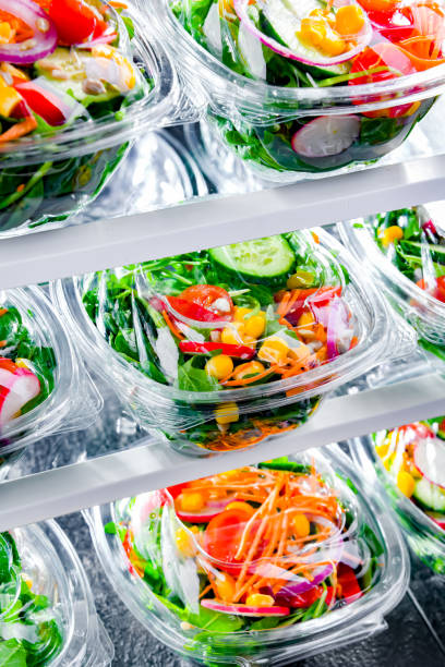 istock Boxes with pre-packaged vegetable salads in a commercial fridge 1458468846
