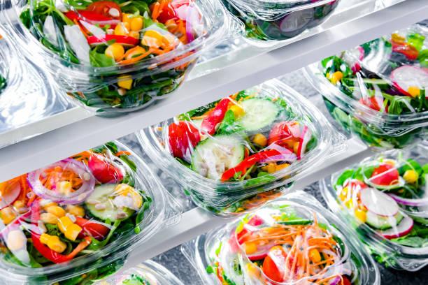 istock Boxes with pre-packaged vegetable salads in a commercial fridge 1458468959