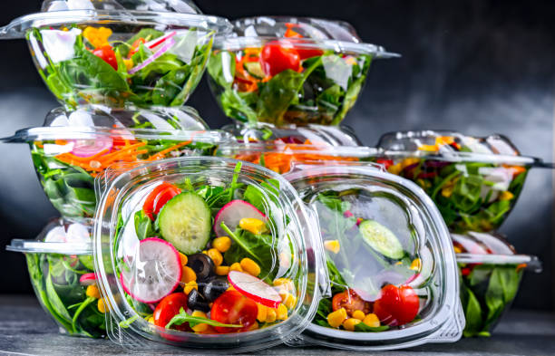 istock Boxes with pre-packaged vegetable salads in a commercial fridge 1458469181