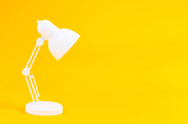 istock The White folding table lamp on yellow background. 1458470111