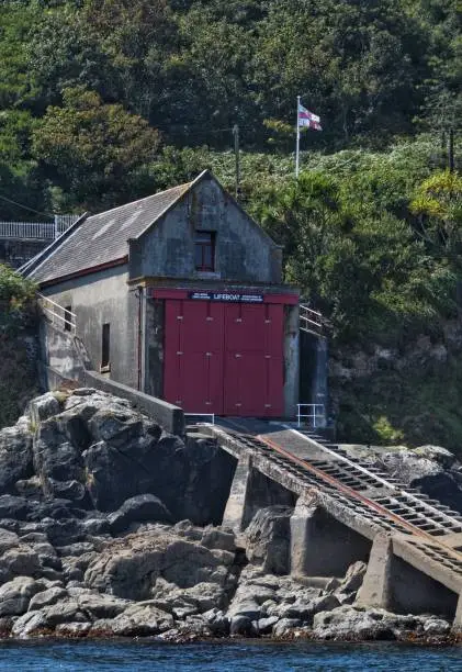 Coastguard lifeboat Station with slipway Cornwall England red doors