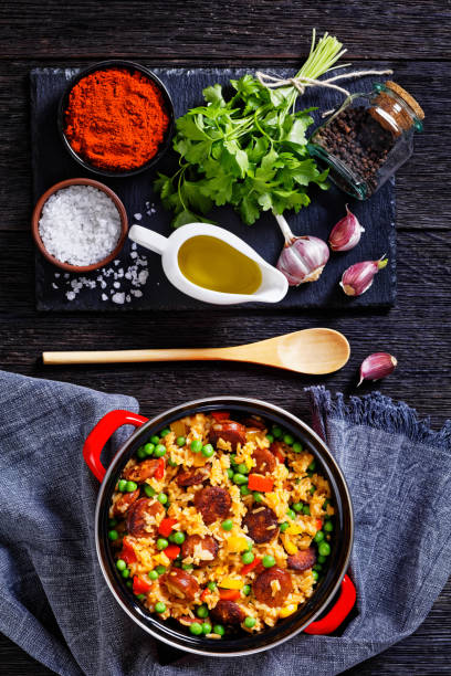 istock smoked sausages with rice and vegetables, top view 1458471829