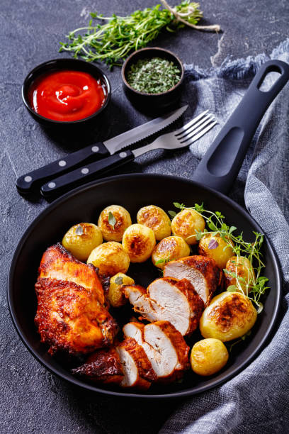 istock grilled chicken breasts with browned new potatoes 1458471861