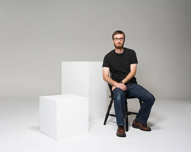 sitting on black chair with white cubes