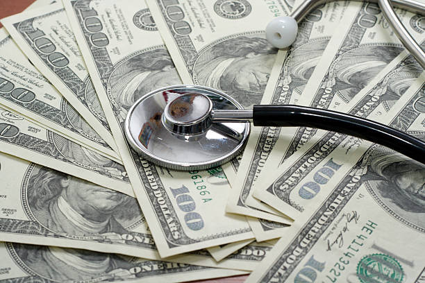 istock The stethoscope lays on dollars 145847533