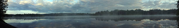 istock Morning fog on wild forest lake 145847927