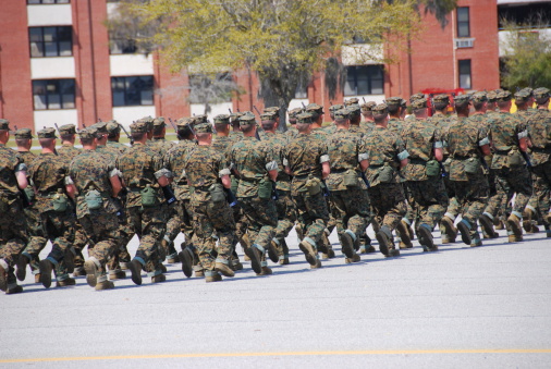 Young marine recruits marching in formation on the parade deck at Parris Island, South Carolina.