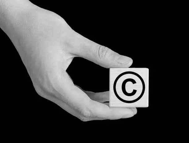 Photo of Copyright violation, piracy concept. Intellectual property crimes, infringements