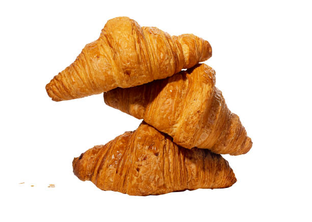 istock Fresh croissants stack, French bakery composition isolated on white background 1458481564