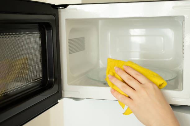 istock microwave washing, cleanliness and hygiene in the kitchen 1458482611