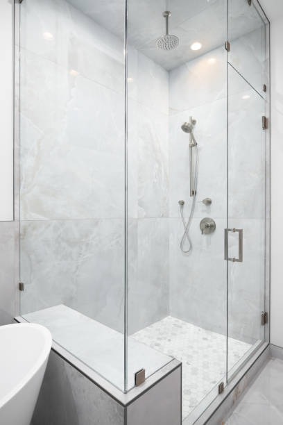istock A walk-in shower with marble tiles. 1458483025