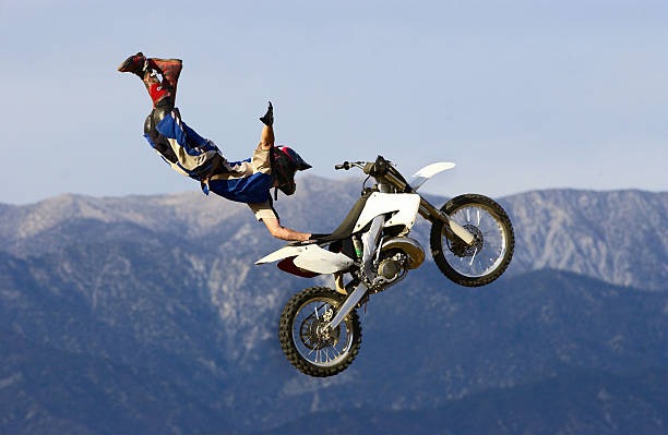 Freestyle Motocross Seat Grab Freestyle motocross athlete executing a trick called a seat grab. x games stock pictures, royalty-free photos & images