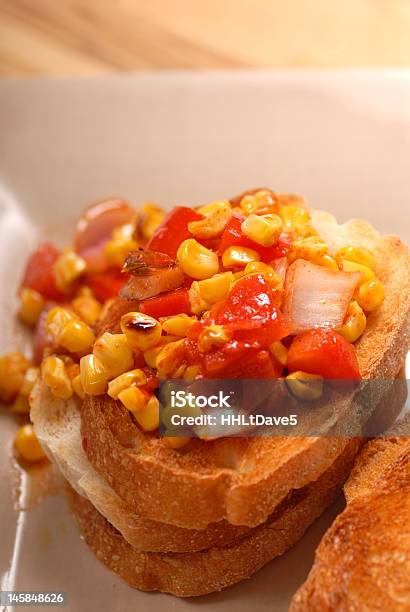 Roasted Corn Tomato And Onion Bruschetta Stock Photo - Download Image Now - Appetizer, Bread, Brown