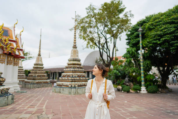 istock Woman exploring  Wat Pho in Bangkok 1458487034