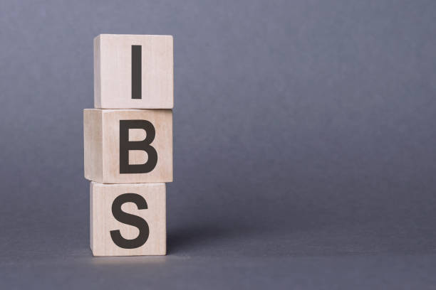 istock IBS - Irritable Bowel Syndrome, text written on wooden blocks, on gray background. 1458487106