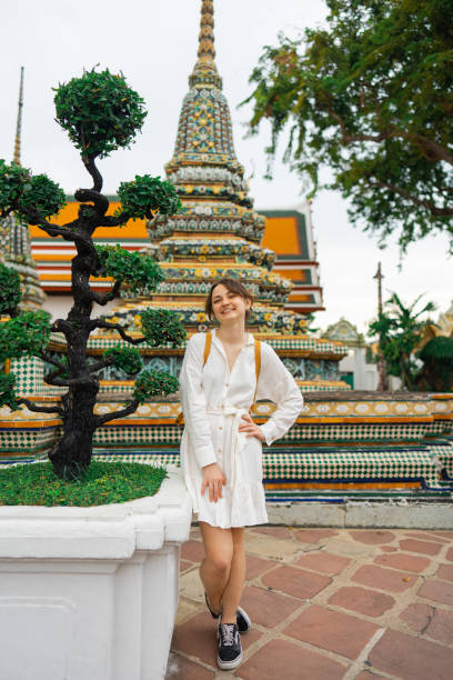 istock Woman exploring  Wat Pho in Bangkok 1458487124
