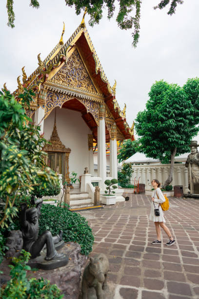 istock Woman exploring  Wat Pho in Bangkok 1458487514