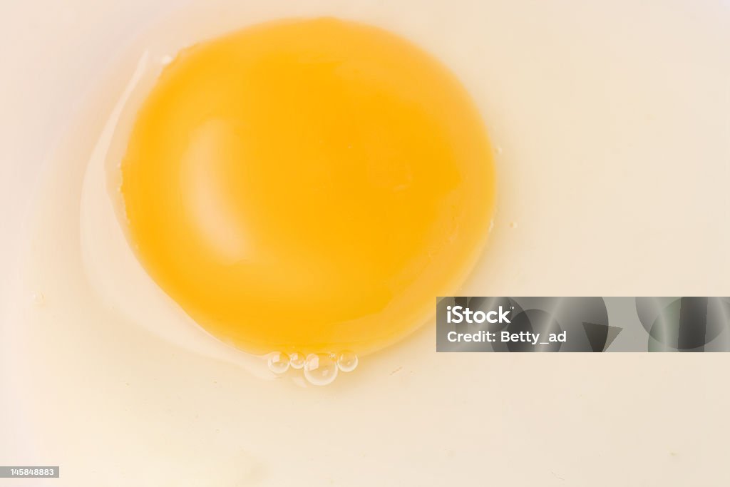 egg yolk up close close-up shot of an egg yolk Animal Egg Stock Photo