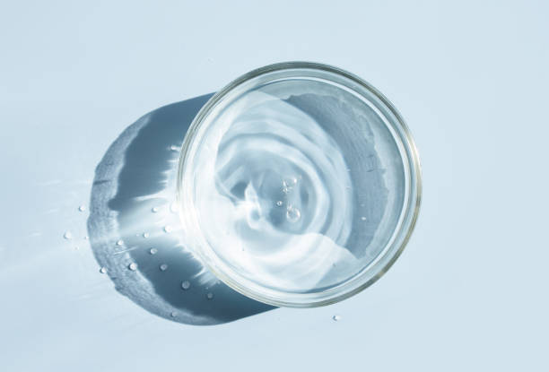 istock petri dish with liquid water on plain on a light background water ripple texture 1458490284