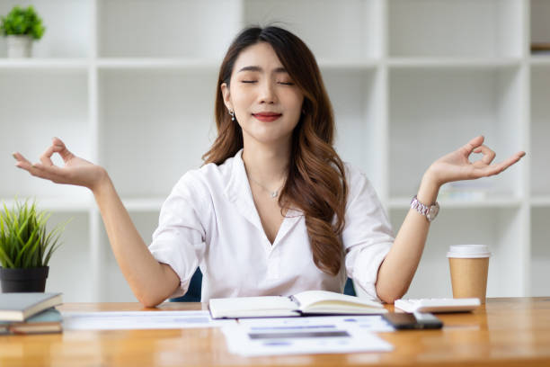 istock Stressful business woman meditating and solving problems. 1458491808