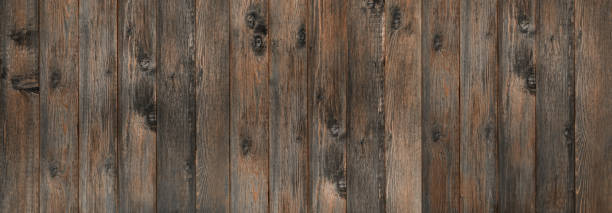 sfondo di legno vecchio marrone. tavole verticali scure in legno vintage - knotted wood plank wall abstract texture foto e immagini stock