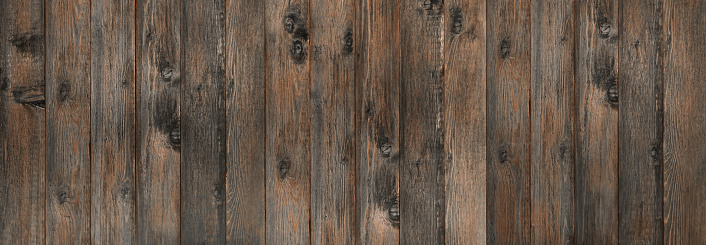 Vintage brown wood background texture with knots. An old painted wooden wall. Brown abstract background. Prerequisites for design