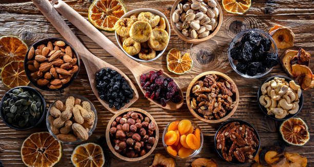istock Composition with a variety of dried fruits and assorted nuts. 1458492855