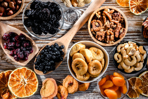 istock Composition with a variety of dried fruits and assorted nuts. 1458492960