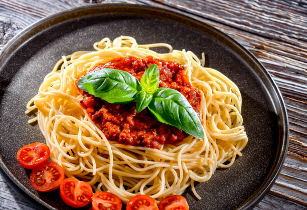 istock Composition with a plate of spaghetti bolognese 1458494059