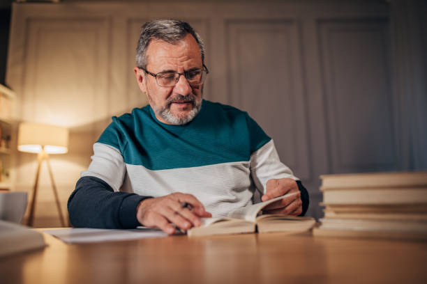 A senior writer works in a home office
