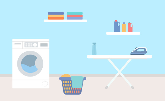 Laundry Room With Washing Machine, Ironing Board, Laundry Basket And Detergents