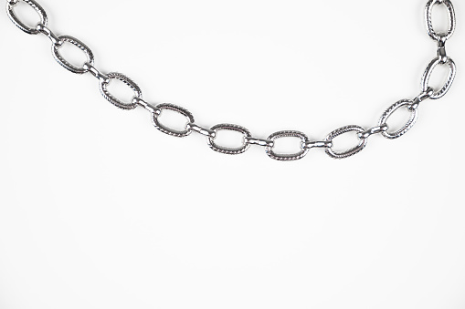 Metal chain isolated on white background. The concept of strength and power.