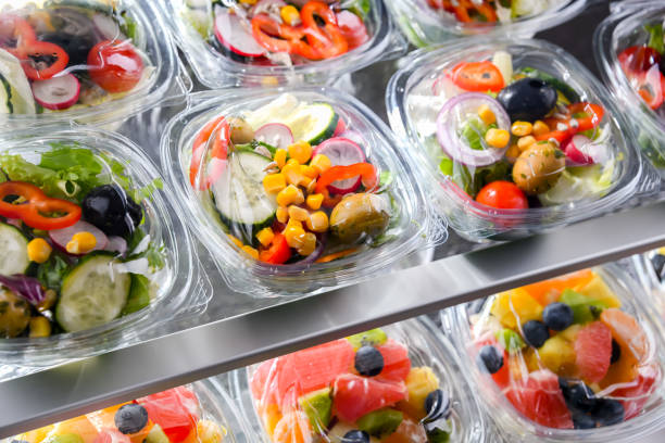 istock Boxes with pre-packaged vegetable salads in a commercial fridge 1458497032