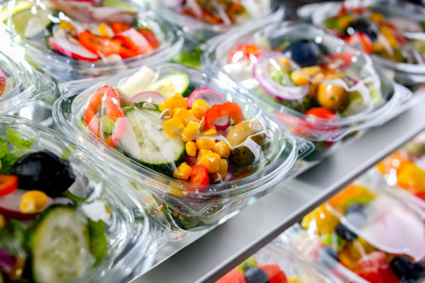 istock Boxes with pre-packaged vegetable salads in a commercial fridge 1458497086