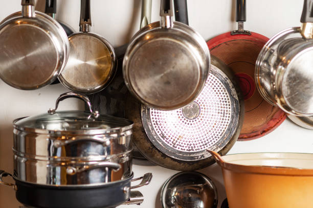istock Pots and pans hang in the kitchen. Kitchen utensils, home interior. 1458497098