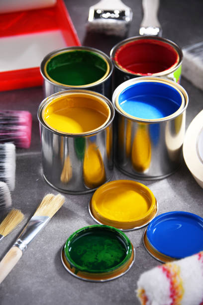 istock Paintbrushes of different size and paint cans 1458497728