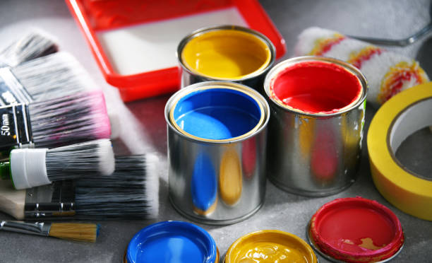 istock Paintbrushes of different size and paint cans 1458497798