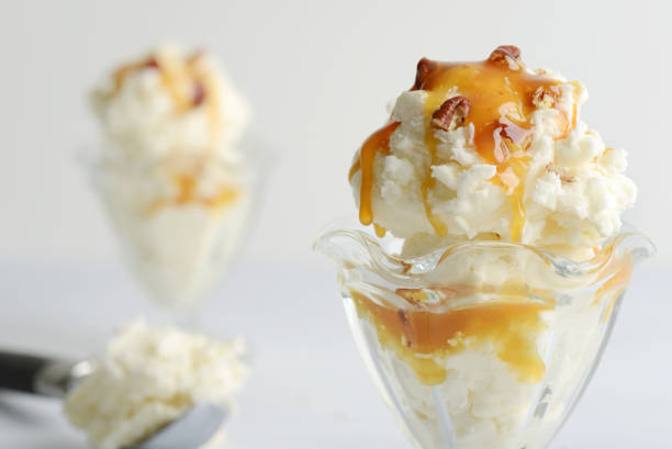 istock closeup vanilla ice cream with pecans and caramel sauce 1458497863