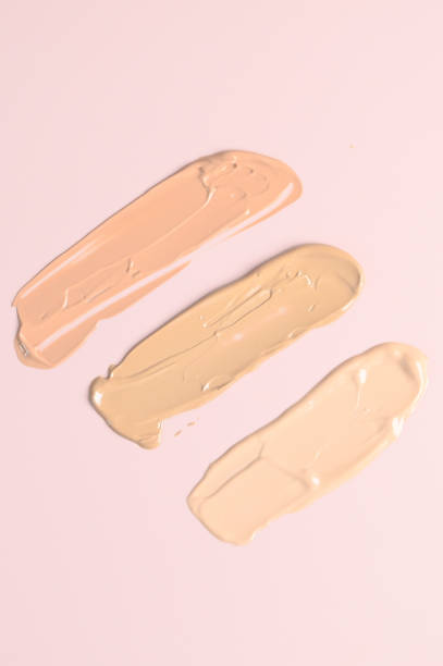istock Makeup foundation smears on pink background. BB, CC cream foundation tonal smudge 1458498242