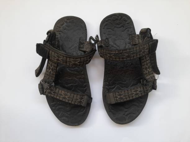 istock black mountain sandals top view on white background. 1458498465