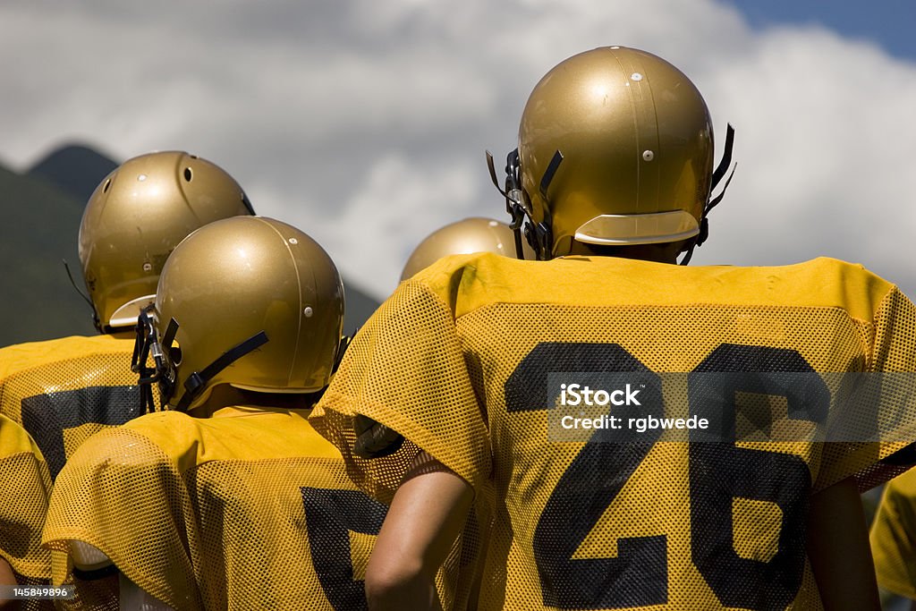 unity is strength teamshot of a football team American Football - Sport Stock Photo